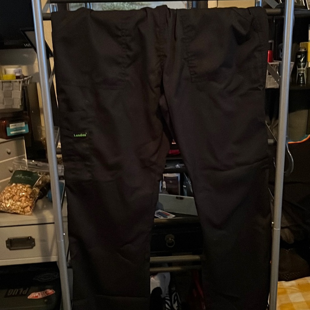 Woman’s black scrubs